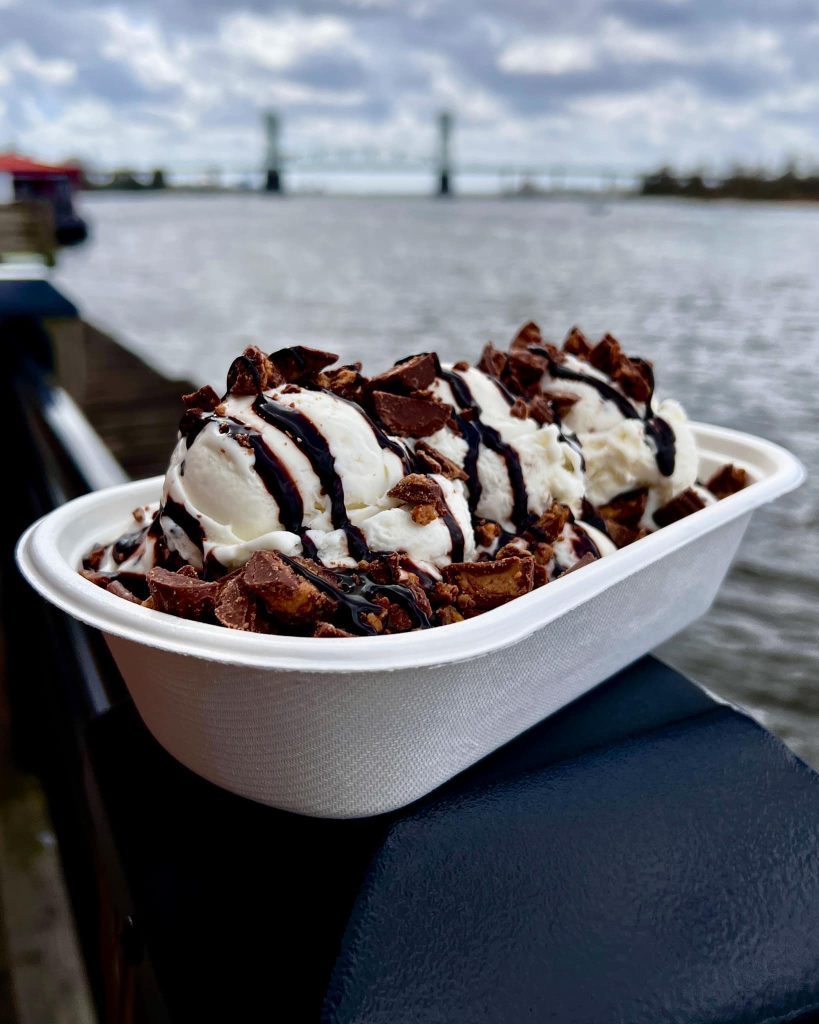 stracciatella in a banana boat of ice cream flavors and toppings